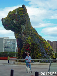 In front of the Guggenheim, big dog - and small